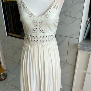 White dress with leather cut out bodice